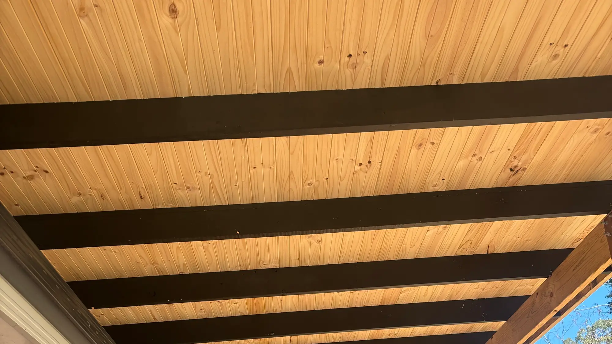 Timber-lined pergola with Colorbond roofing by BT Built in Lilydale
