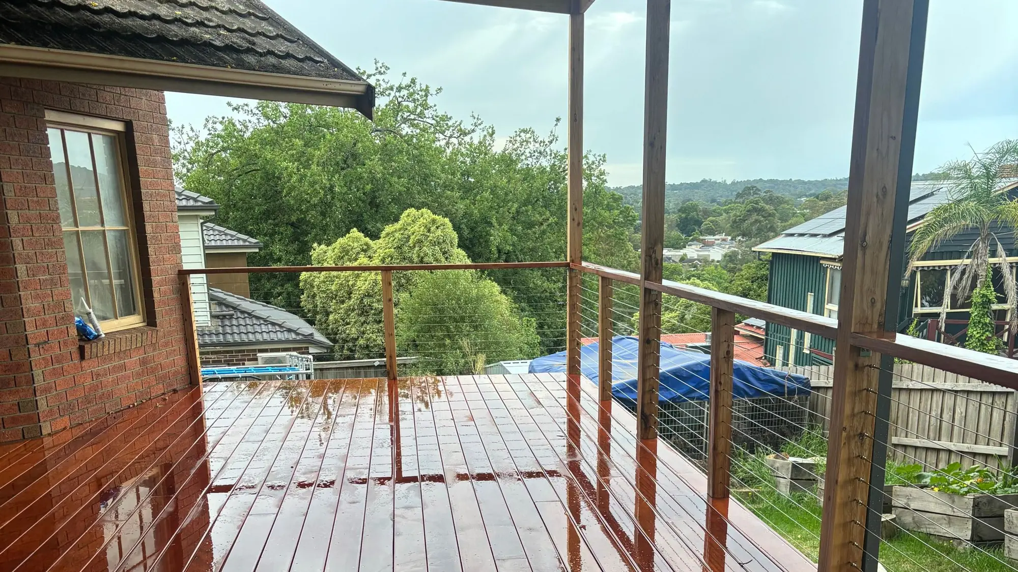Elevated hardwood entertainer's deck by BT Built in Mount Evelyn